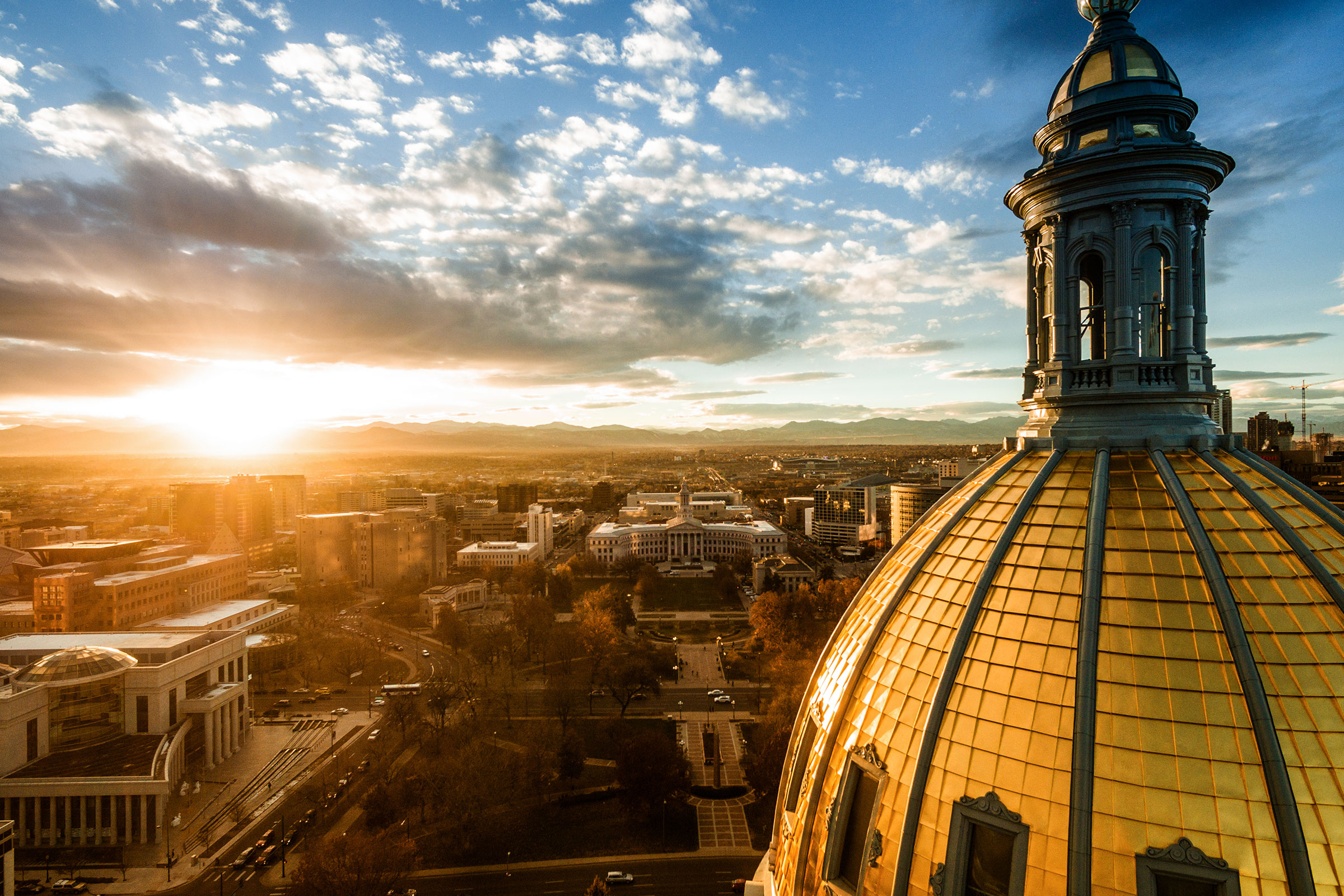 Aerial photograph of a sunset over the Colorado state capital building in Denver