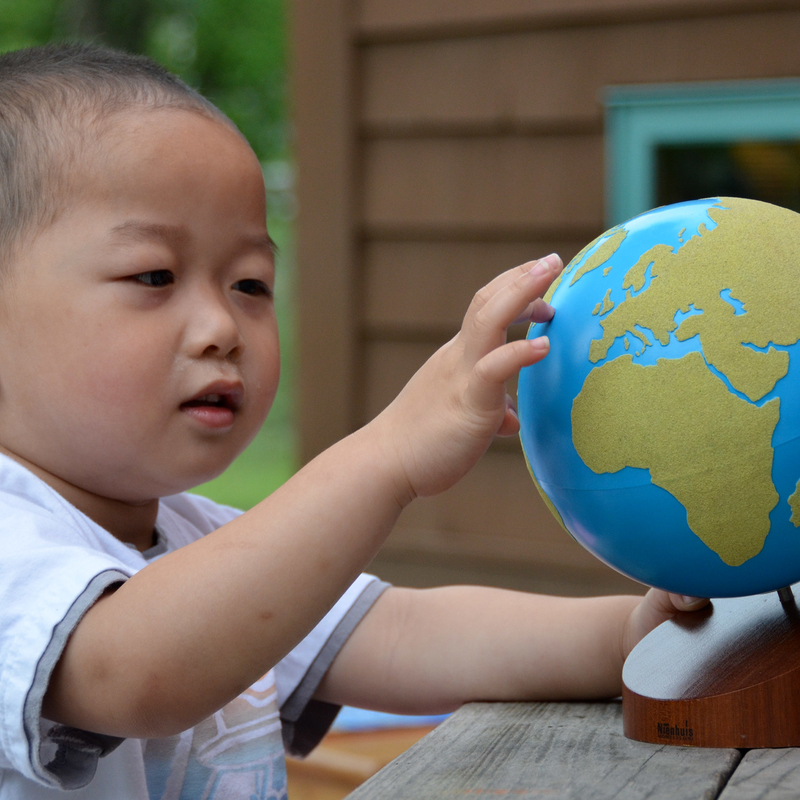 Child using sandpaper globe